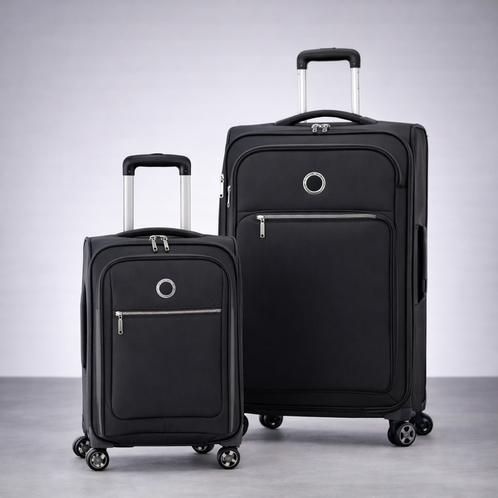 Two black suitcases with visible brand logo on a gray background