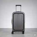 Delsey Paris metallic dark grey hard-shell carry-on luggage standing upright on a clean, light grey studio background.